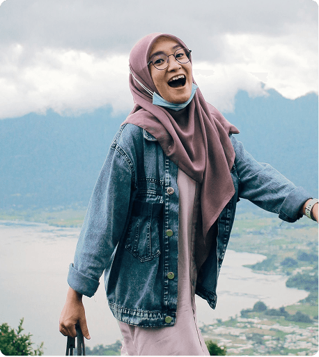 Traveler smiling on a mountain overlook